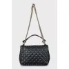 Quilted bag decorated with spikes