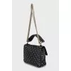 Quilted bag decorated with spikes