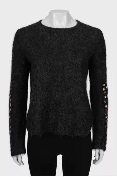 Loose sweater with embroidery on the sleeves