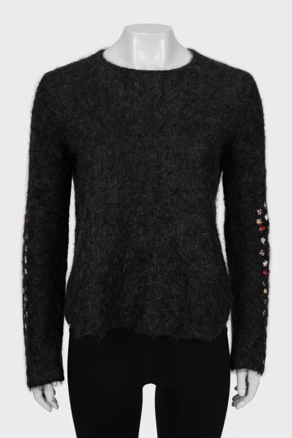 Loose sweater with embroidery on the sleeves