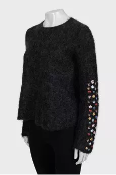 Loose sweater with embroidery on the sleeves