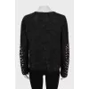 Loose sweater with embroidery on the sleeves