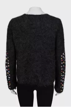 Loose sweater with embroidery on the sleeves