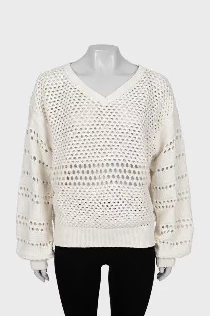 Perforated sweater with voluminous sleeves
