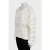 Perforated sweater with voluminous sleeves