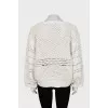 Perforated sweater with voluminous sleeves