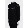 Textured sweater decorated with rhinestones