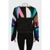 Knitted sweater with slits on the sleeves