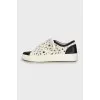 Sneakers with perforated leather
