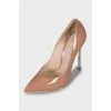 Patent leather shoes with metal heels