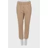 Tapered trousers with stripes