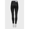 Leather trousers with silver buttons