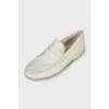 Men's white loafers with embossed leather