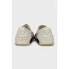 Men's white loafers with embossed leather