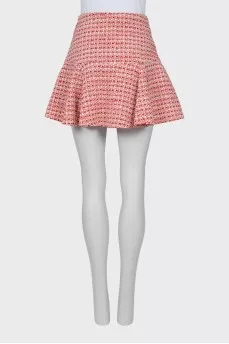 Tweed skirt decorated with buttons