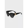 Sunglasses with gold logo on temples