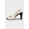 Sandals with textile heels and tag