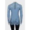 Blue blouse decorated with lace