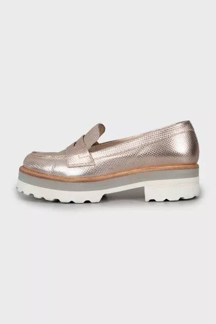 Gold loafers with embossed leather
