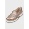 Gold loafers with embossed leather