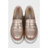 Gold loafers with embossed leather