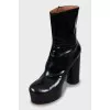 Black patent leather ankle boots