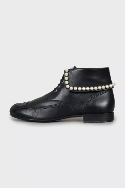 Leather boots decorated with beads