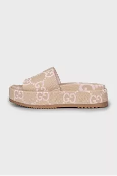 Textile slippers with a signature print