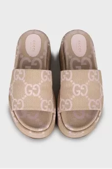 Textile slippers with a signature print