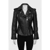 Leather jacket decorated with buckles