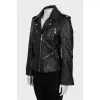 Leather jacket decorated with buckles
