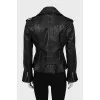 Leather jacket decorated with buckles