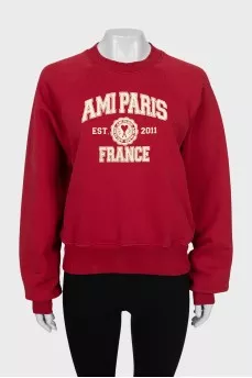 Red sweatshirt with text print