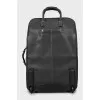 Leather suitcase with contrasting seams