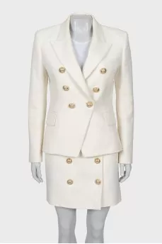 Suit with a skirt and golden buttons