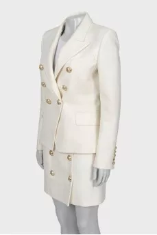 Suit with a skirt and golden buttons