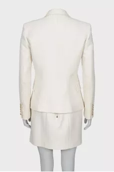 Suit with a skirt and golden buttons