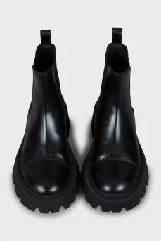 Black boots with a textured sole