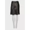 Leather skirt with metal decor