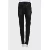 Skinny jeans with gold zippers