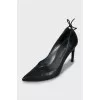 Leather shoes with ties at the back
