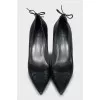 Leather shoes with ties at the back