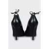 Leather shoes with ties at the back