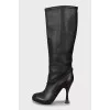 Leather boots with a figured heel