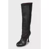 Leather boots with a figured heel