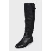 Black leather boots with low heels