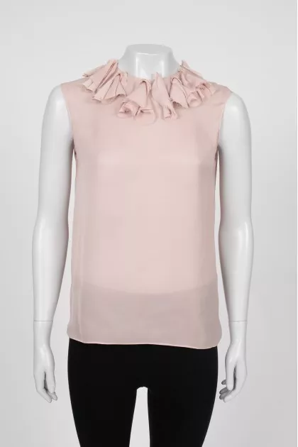 Beige tank top decorated with frills
