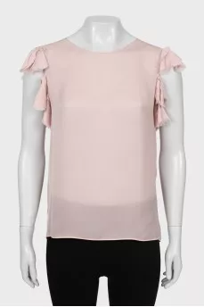 Beige tank top decorated with frills