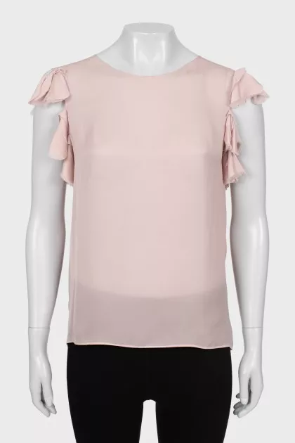 Beige tank top decorated with frills