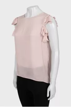 Beige tank top decorated with frills